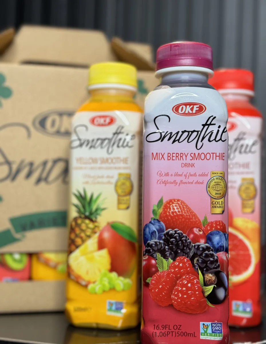 Real OKF smoothie bottles beside their carton